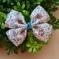 Meet Me at the Carnival Medium Wren Bow
